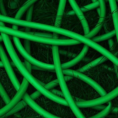 Twisted green garden hose