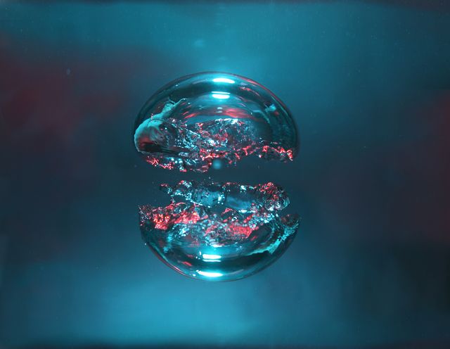 two bubbles of air, blue and red, forming two halves of a sphere