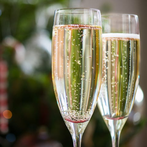 Two Champagne Flutes on Christmas Background