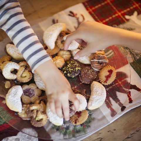 two children choosing traditional german christmas cookies