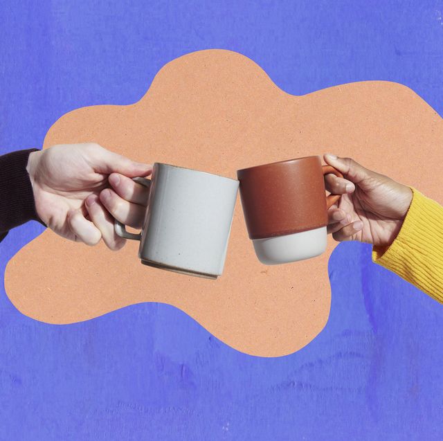 two coffee mugs touching
