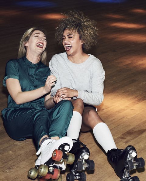 two friends having fun at roller disco