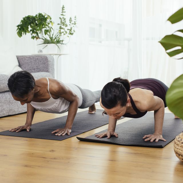 two women doing gymnastics at home