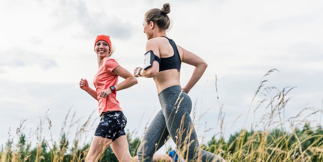 two women running in the countryside