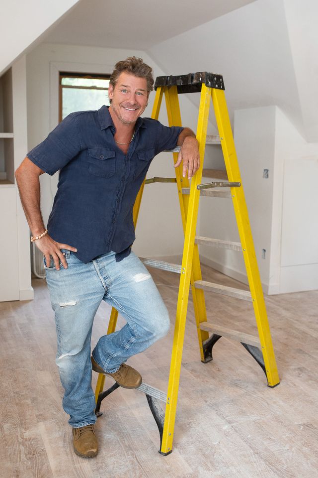 as seen on hgtv's ty breaker, host ty pennington stands in a garage apartment he is renovating
