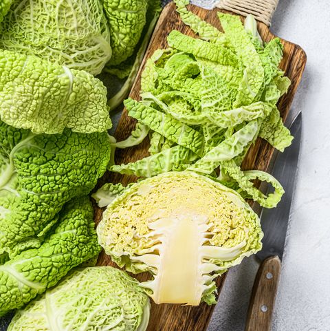 sliced savoy cabbage from organic grower farm white background top view