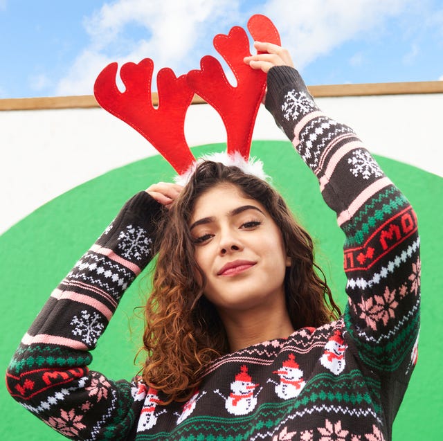 woman wearing ugly christmas sweater