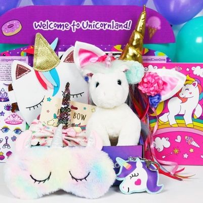 unicorn themed subsciption kit that includes sleeping mask key chain purse stuffed animal and more
