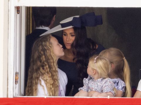 meghan markle with savannah phillips and mia tindall in the  major general's office overlooking the trooping of the colour on horse guards parade