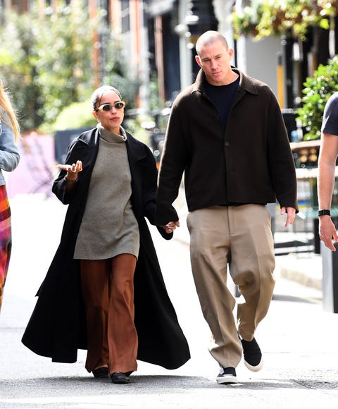 zoe and channing hold hands while walking down the street