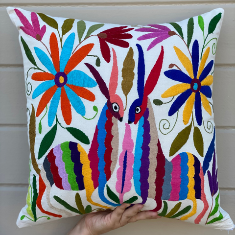 one of yvette perez's pillow creations, featuring traditional otomi embroidery