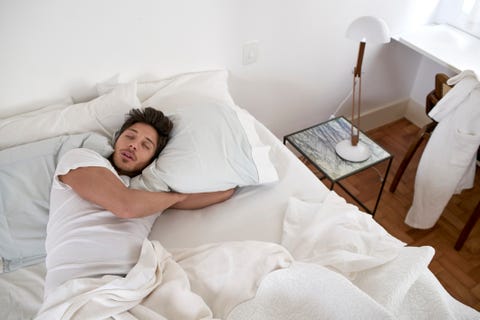 up view of man sleeping in bed