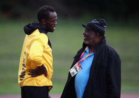 Usain Bolt y su entrenador Glen Mills