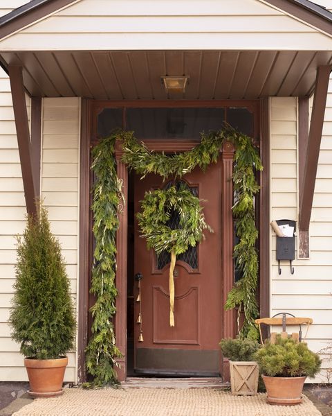 'tis a gift to be simple homeowners merrilee liddiard and jon liddiarda handmade wreath at the door hints at the family’s holiday signature style natural and edited scandinavian décor christmas greenery, christmas decor, holiday
