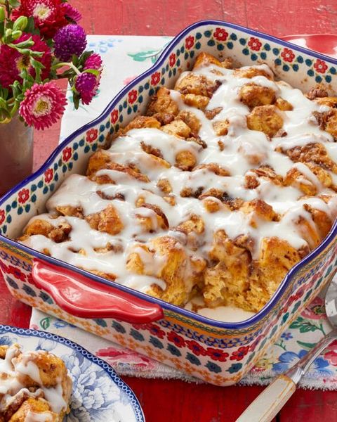 valentines day breakfast cinnamon roll casserole with flowers in back