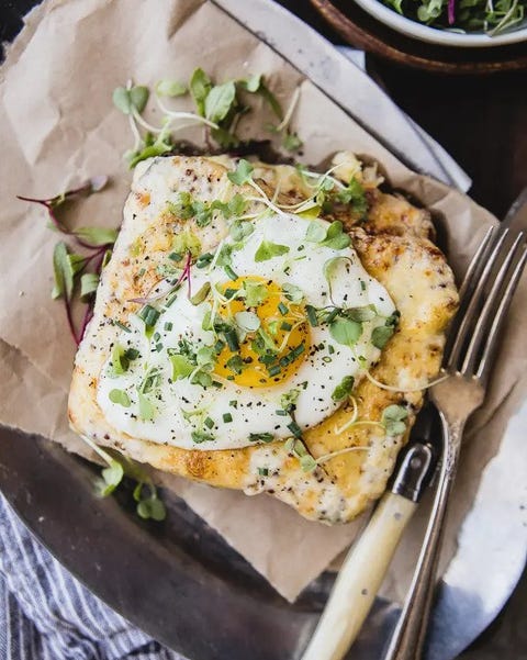 croque madame on paper with fork