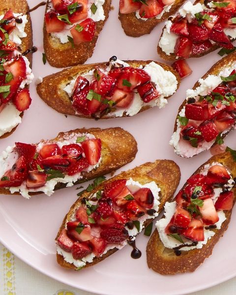 valentines day breakfast strawberry and goat cheese crostini on pink plate