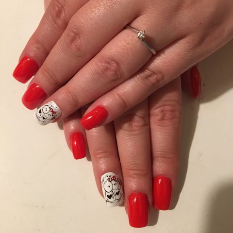 young girl hands decorated for st valentine red nail gel varnish and love design