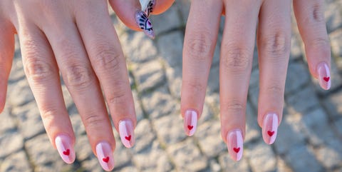 Heart shape nail art valentines day concept nail polish