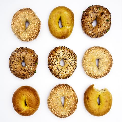 various bagels, one with bite missing