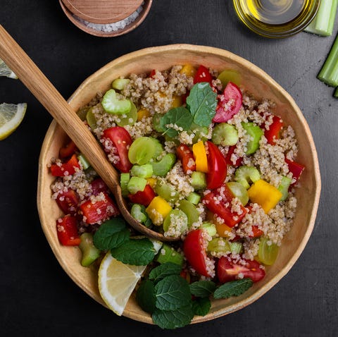 Quinoa salad with red and yellow bell peppers tomatoes, celery and grapes Quinoa salad with red and yellow bell peppers tomatoes, celery and grapes