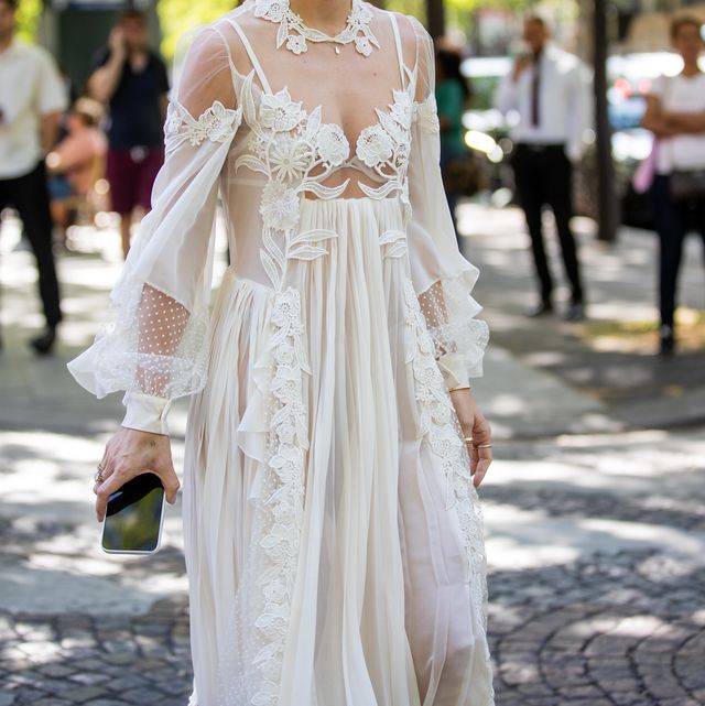 paris, france   july 06 a guest is seen wearing white sheer dress outside zuhair murad during paris fashion week   haute couture fall winter 2022 2023  day three on july 06, 2022 in paris, france photo by christian vieriggetty images