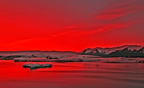 Vibrant Red Sunset Over Icebergs in Jokulsarlon Glacier Lagoon, Iceland