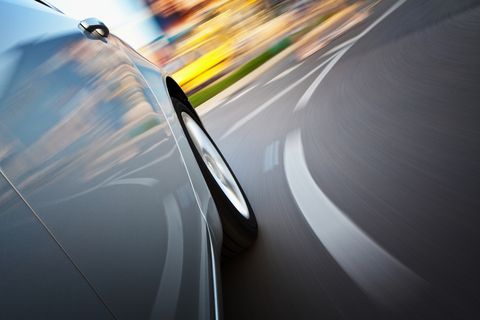 A view from a side of a car in motion