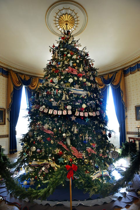 First Lady Michelle Obama welcomes military families to share in this year's White House holiday decoration in Washington, DC.