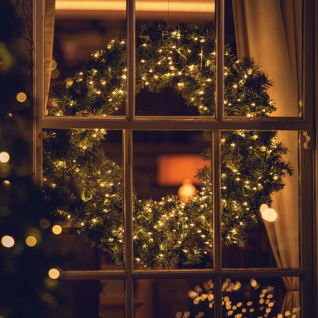 view through a window of a christmas wreath in a living room