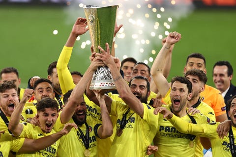 villarreal's spanish defender raul albiol lifts the trophy after winning the uefa europa league final football match between villarreal cf and manchester united at the gdansk stadium in gdansk on may 26, 2021