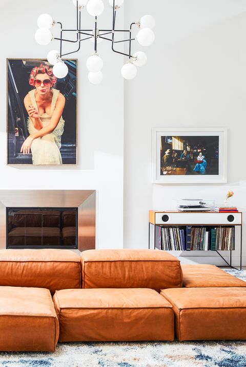 living room with large leather sectional and records