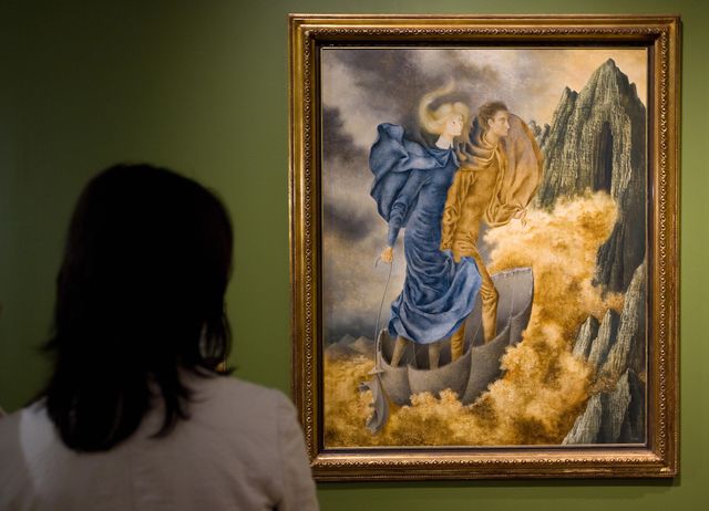 a visitor watches a painting by spanish