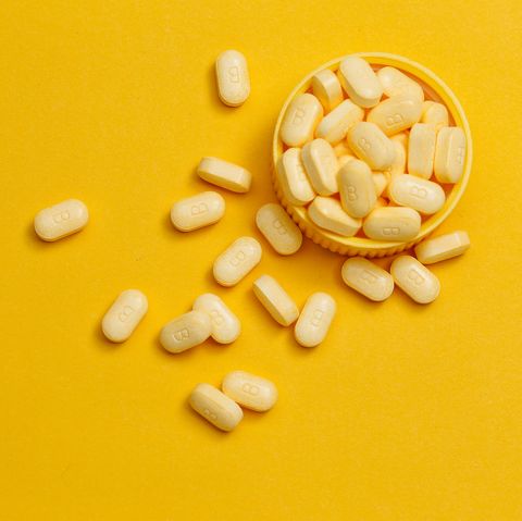 vitamin b tablets on yellow background