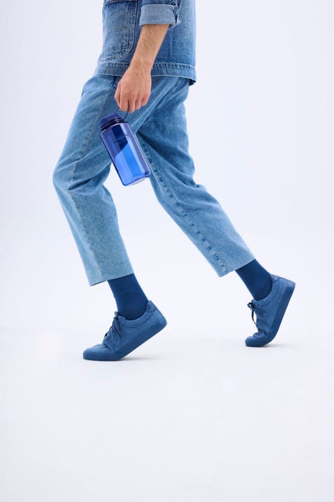 person holding nalgene bottle in denim blue