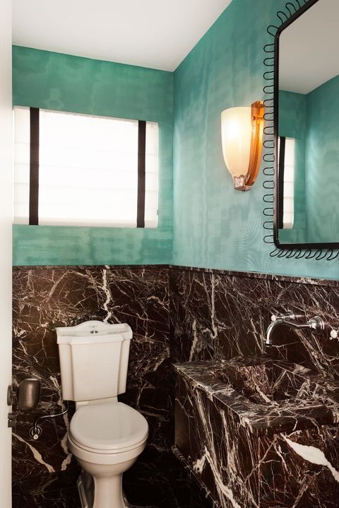 bathroom with turquoise wallpaper