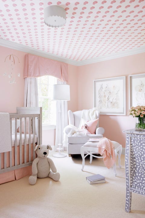 nursery room with wallpaper on ceiling