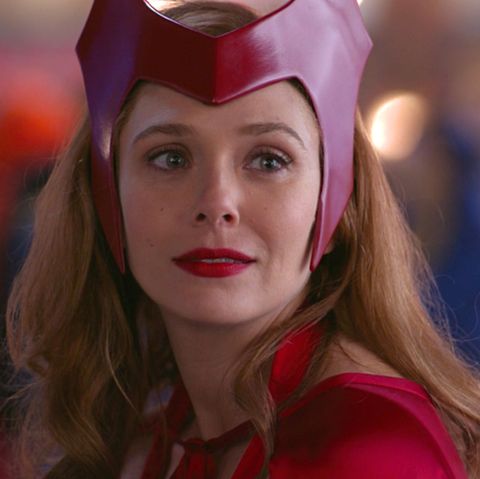 wanda is dressed for halloween as she looks across at pietro in wandavision episode 6