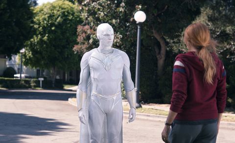 white vision faces wanda on a street in westview in wandavision episode 9