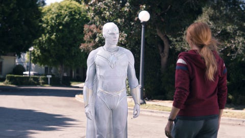 white vision faces wanda on a street in westview in wandavision episode 9