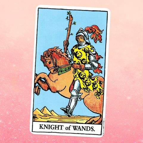 the tarot card the knight of wands, showing a knight in armor riding on a horse while holding a wooden staff, in the background there's a desert landscape with pyramids or mountains