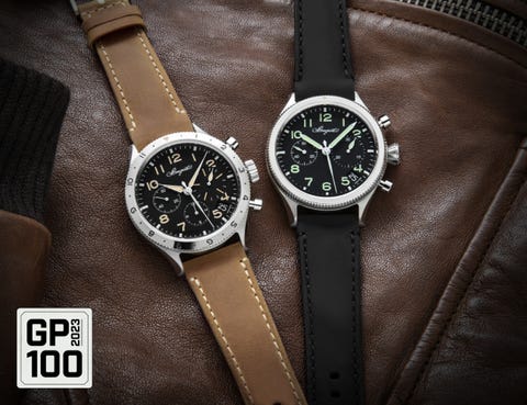 a couple of watches on a leather surface