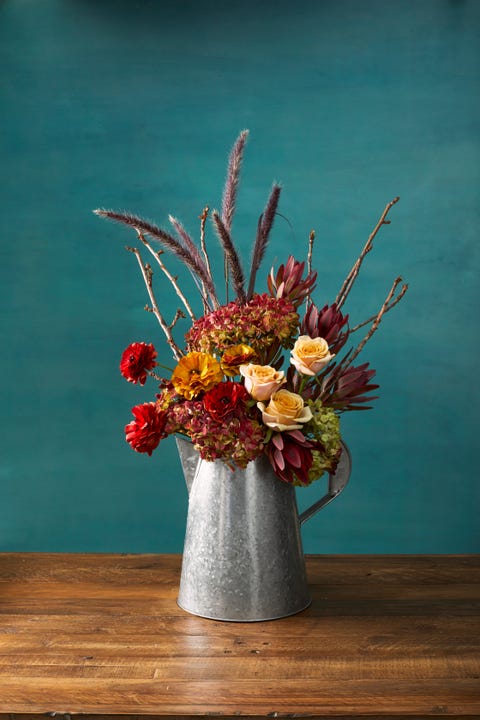 pretty pitcher autumn flower arrangement