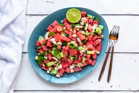 Watermelon salad with feta, cucumber, mint and lime dressing on plate watermelon salad with feta, cucumber, mint and lime dressing on plate