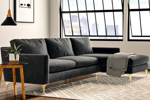 sofa, sidetable and ottoman in a room