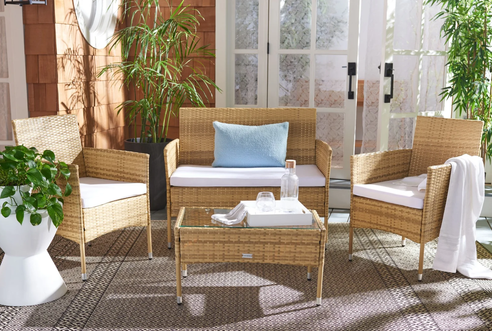 The Weatherproof Rattan Patio Set That's Nearly 60% Off at Wayfair Right Now