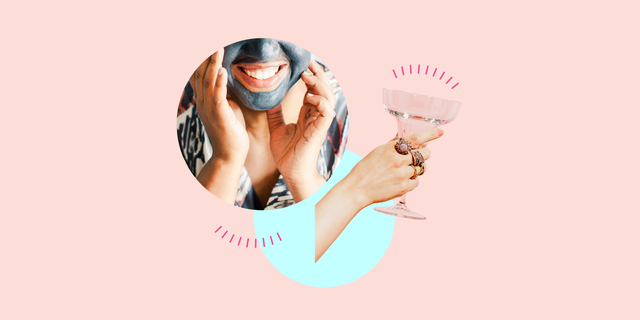 a woman wearing a face mask, drinking a cocktail
