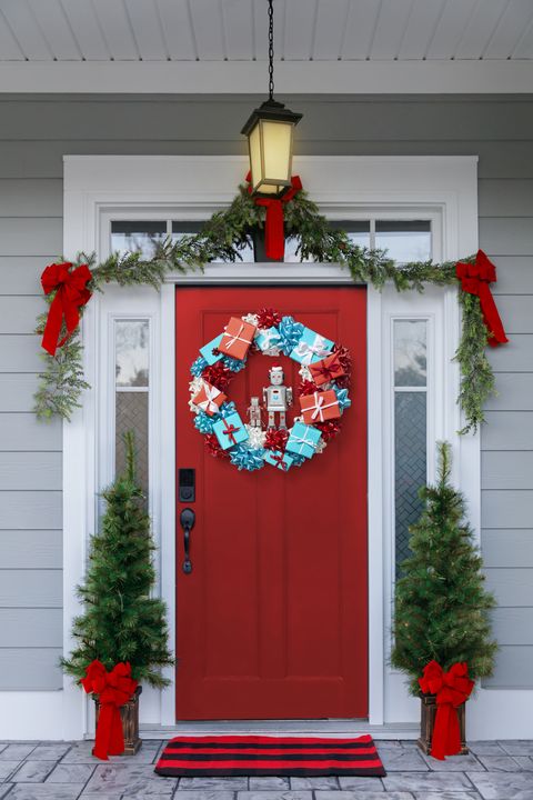 christmas porch decorations robot gift box wreath and red door