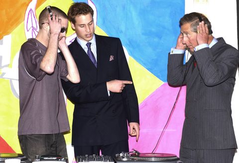 ﻿Carlo and William try out a DJ console during a visit to the facility in 2003.