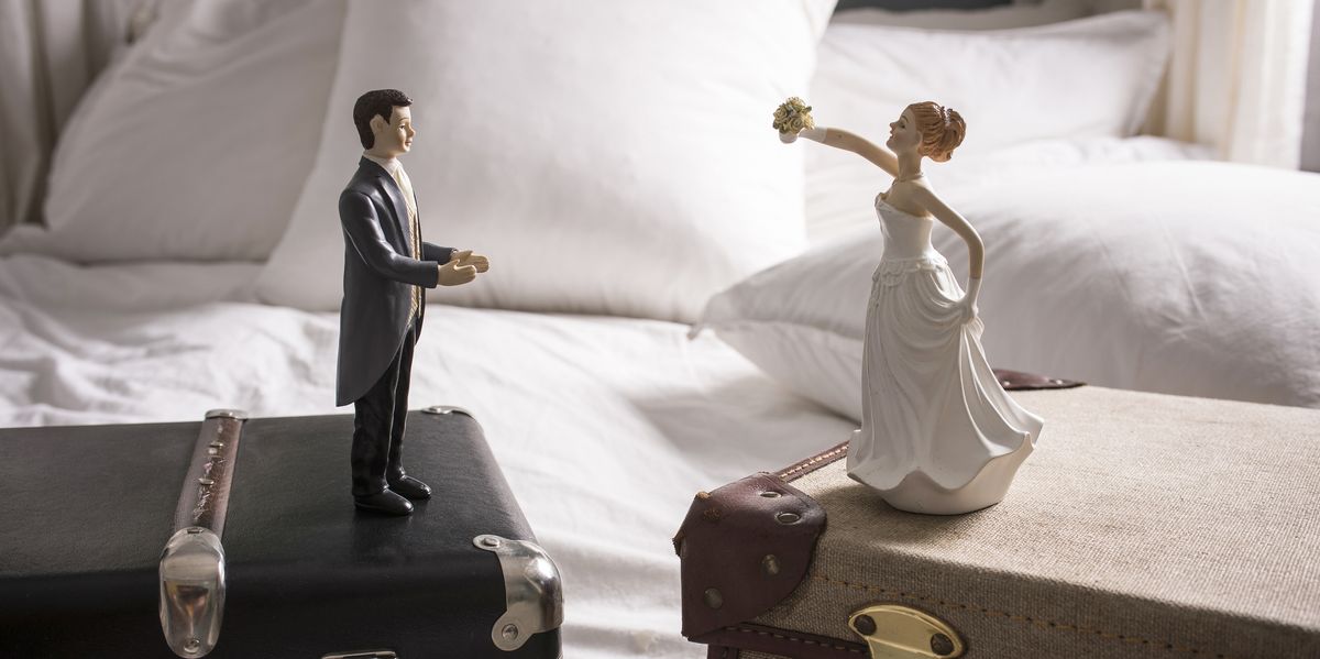 Wedding figurines on separate suitcases royalty free image 475150367 1563376112.jpg?crop=1xw:0